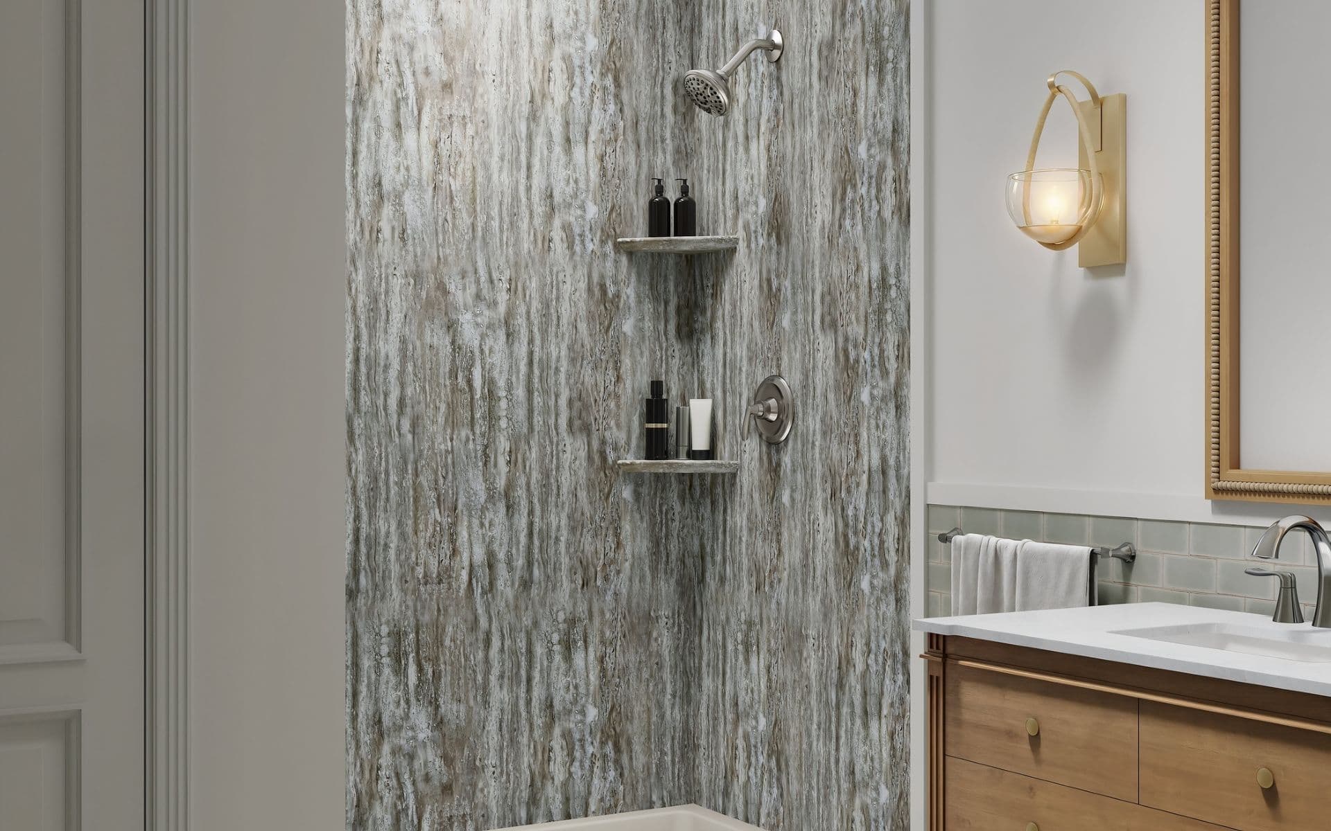 Modern bathroom shower area with weathered gray tile walls, chrome showerhead, two floating shelves holding toiletries, and valve control.